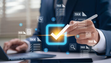 Professional businessman approving tax checklist with stylus on digital screen, managing financial documents, verifying tax filing accuracy, and ensuring compliance during electronic return season